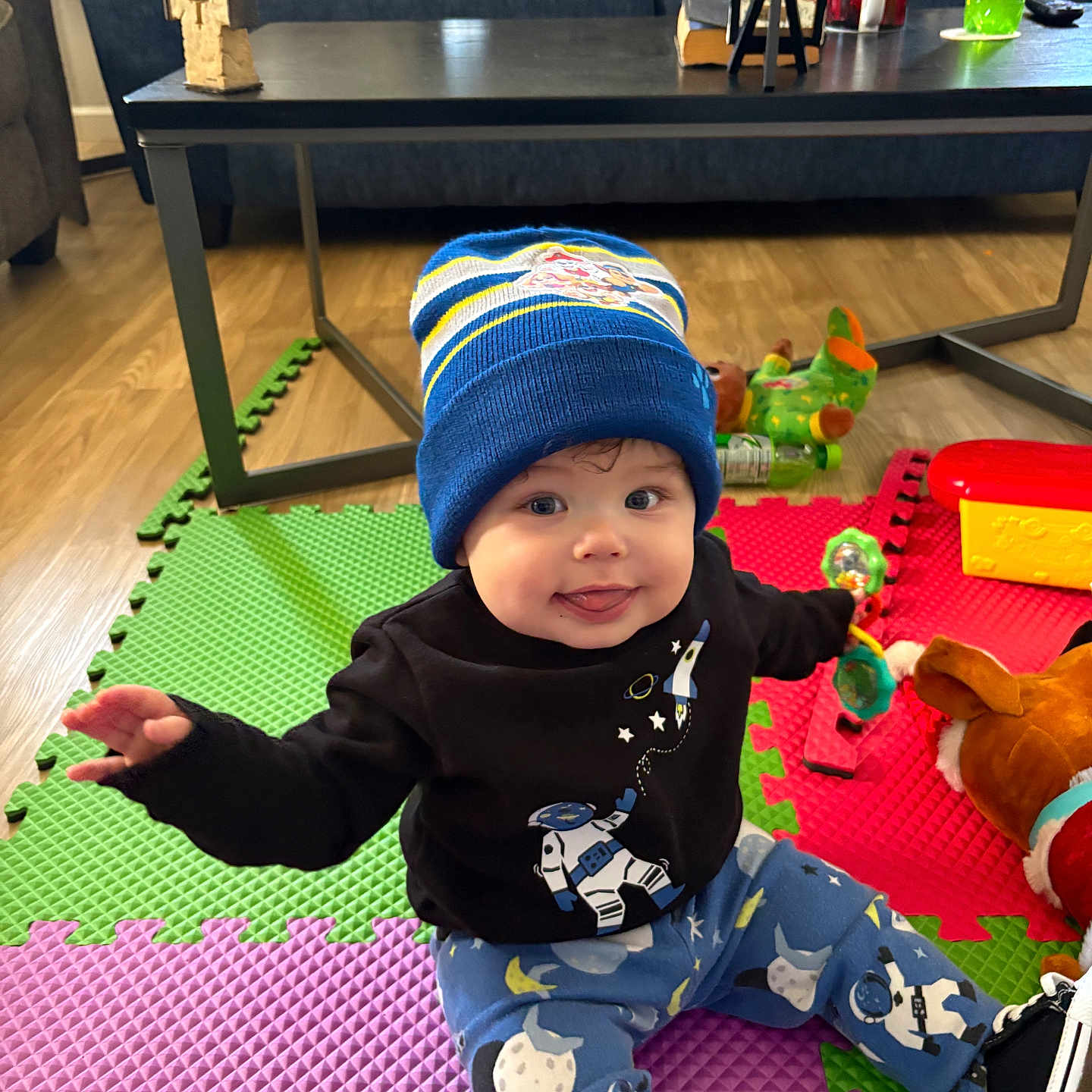 Jagger is registered to the contest to win money with this photo: architecture, baby, beanie, building, cap, clothing, couch, face, furniture, hat, head, indoors, interiordesign, livingroom, person, photography, portrait, room, toy, wood