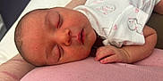 éline participe au concours pour gagner de l'argent avec cette photo : newborn, baby, sleeping, infant, face, hand, clothing, pink, white, cute, animal_print, soft, resting, peaceful, closeup, skin, delicate, portrait, child, lying_down