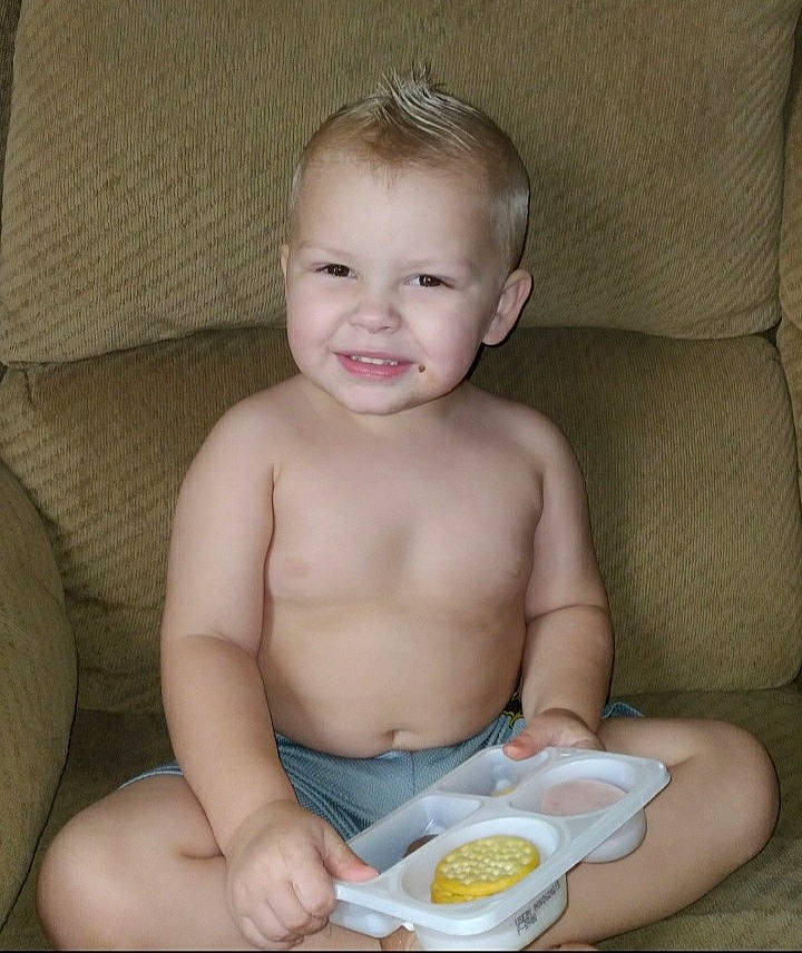 Keagan is registered to the contest to win money with this photo: baby, baby_food, bowl, cheek, chest, child, couch, diaper, finger, food, happy, iris, joy, mouth, muscle, neck, person, skin, smile, stomach