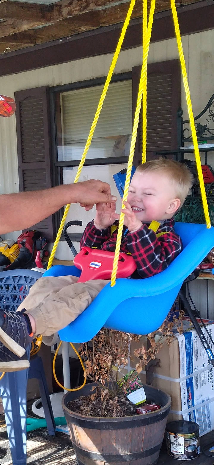 Keagan joined the competition — help win amazing prizes! baby, baby_products, baby_toddler_clothing, blue, chair, child, city, electric_blue, fun, joy, leisure, outdoor_play_equipment, person, play, playground, recreation, sitting, smile, swing, toddler