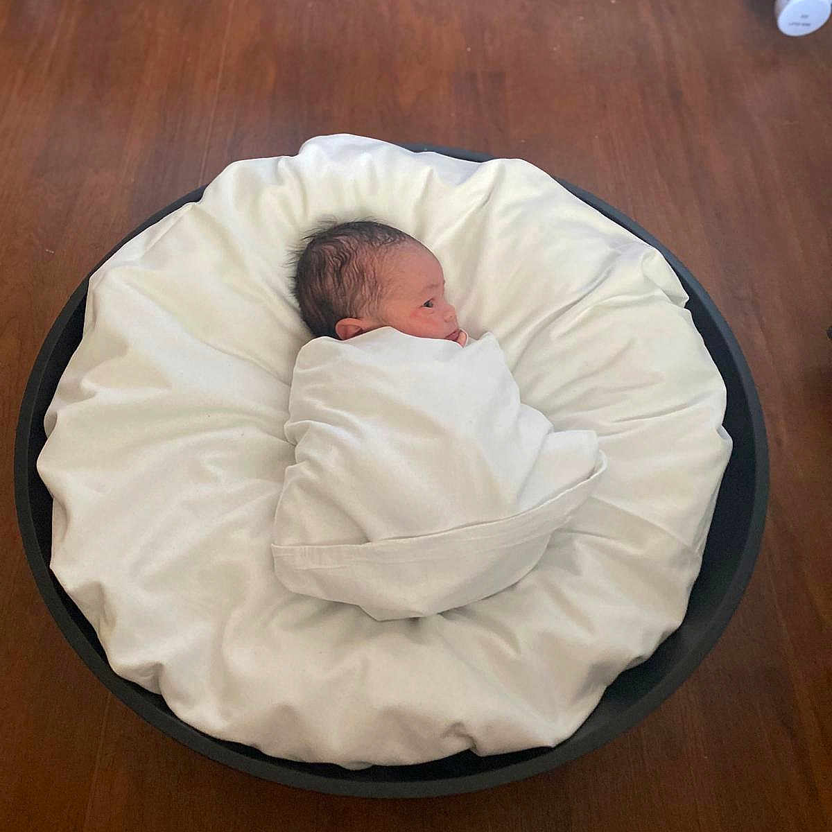 Yass is registered to the contest to win money with this photo: baby, blanket, cushion, homedecor, infantbed, person, pillow