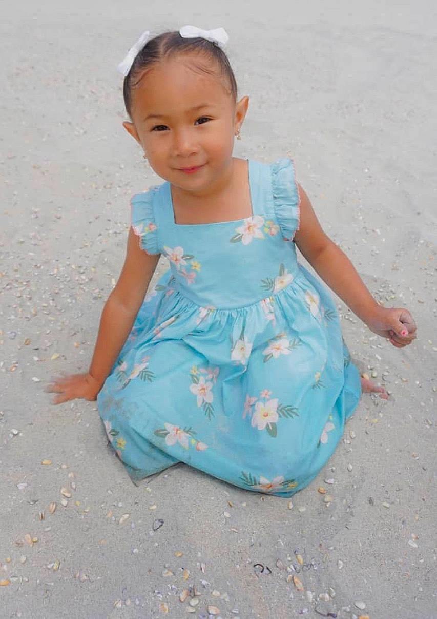 Rosalynn is registered to the contest to win money with this photo: aqua, baby_toddler_clothing, blue, child, clothing, dress, joy, pattern, person, toddler, turquoise