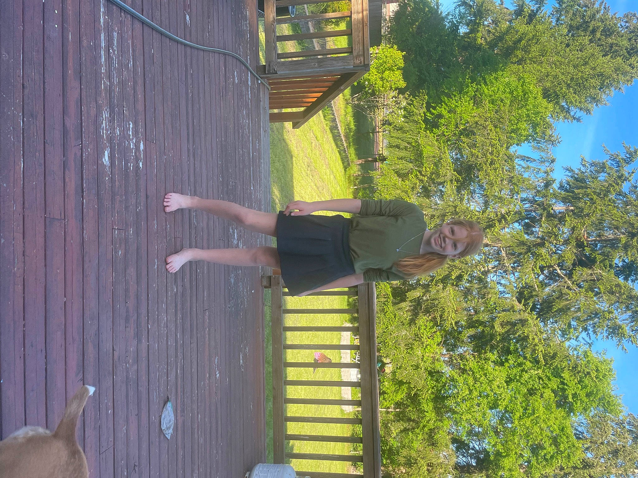 Addi is registered to the contest to win money with this photo: facade, fun, grass, green, joy, leisure, person, plant, recreation, shadow, sky, t_shirt, tree, urban_design, wood