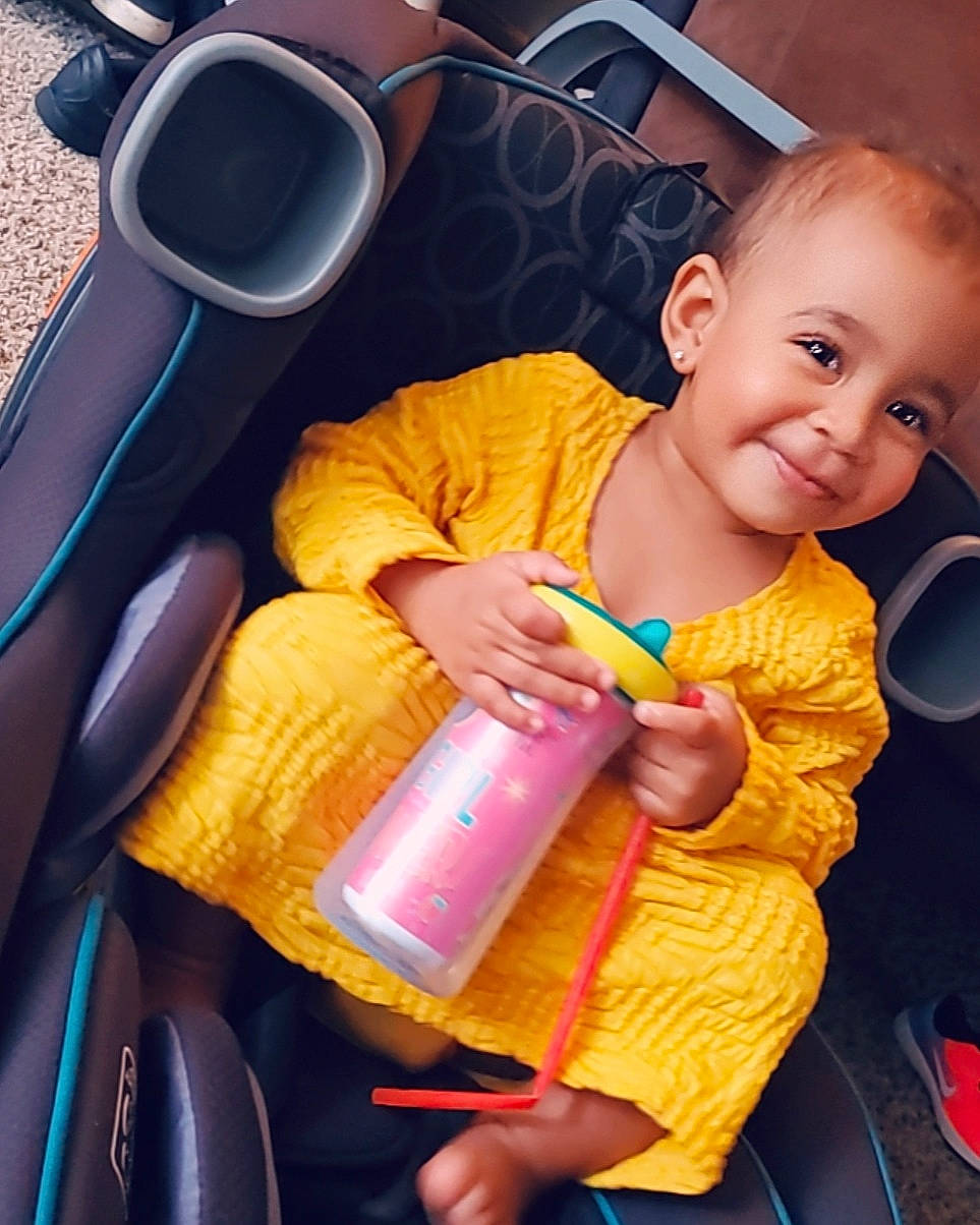 Naya is registered to the contest to win money with this photo: baby, car_seat, child, joy, person, play, smile, toddler, yellow
