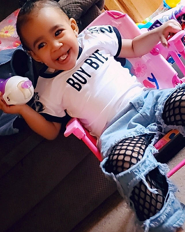 Naya is registered to the contest to win money with this photo: arm, baby, ball, beauty, child, footwear, happy, joy, leg, person, pink, play, shoe, sports_equipment, sports_gear, sportswear, toddler