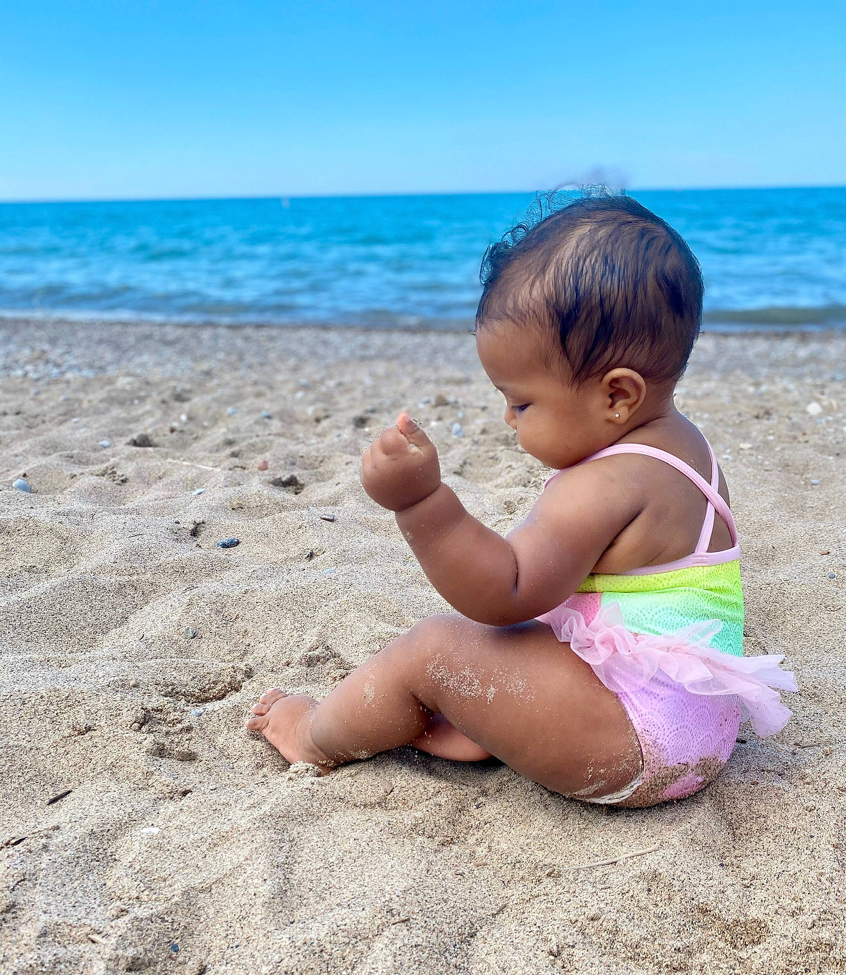Anastasia is registered to the contest to win money with this photo: baby, beach, child, coast, fun, hand, happy, leg, leisure, ocean, person, play, sand, sea, sitting, skin, sky, smile, summer, toddler