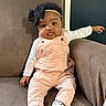 Graice is registered to the contest to win money with this photo: baby, child, infant, portrait, sitting, armchair, couch, bow, headband, overalls, pink_clothing, white_shirt, socks, face, smiling, indoor, furniture, fashion, adorable, photography