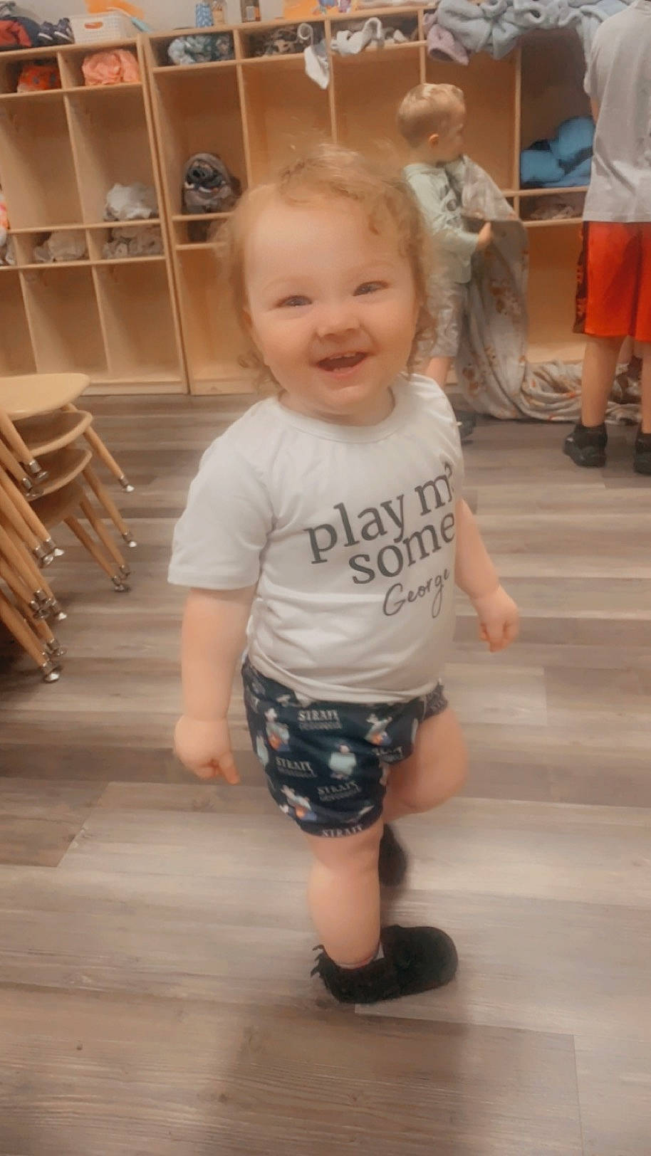 Emmerson joined the competition — help win amazing prizes! baby_toddler_clothing, cheek, child, eye, face, floor, flooring, happy, joint, joy, leg, person, shelf, shoe, shorts, skin, sleeve, smile, standing, t_shirt