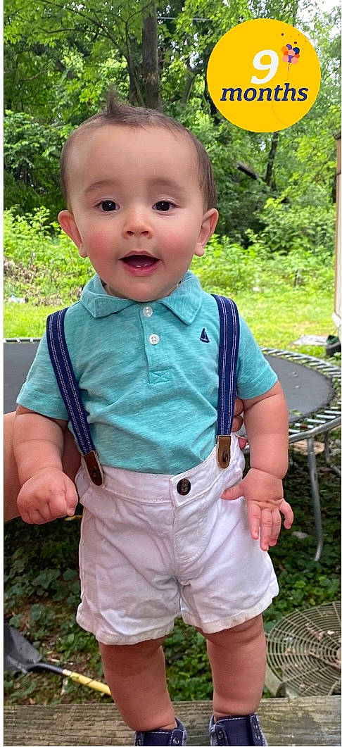 Jaxton is registered to the contest to win money with this photo: baby, baby_toddler_clothing, balloon, eye, face, grass, green, happy, head, leaf, nose, outerwear, pattern, people_in_nature, person, plant, sleeve, smile, summer, t_shirt