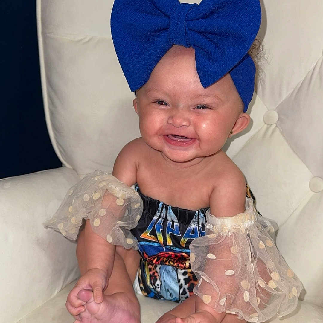 Navy Kate joined the competition — help win amazing prizes! accessories, baby, clothing, costume, couch, cushion, dress, face, formalwear, furniture, happy, hat, head, homedecor, person, photography, pillow, portrait, sitting, tie