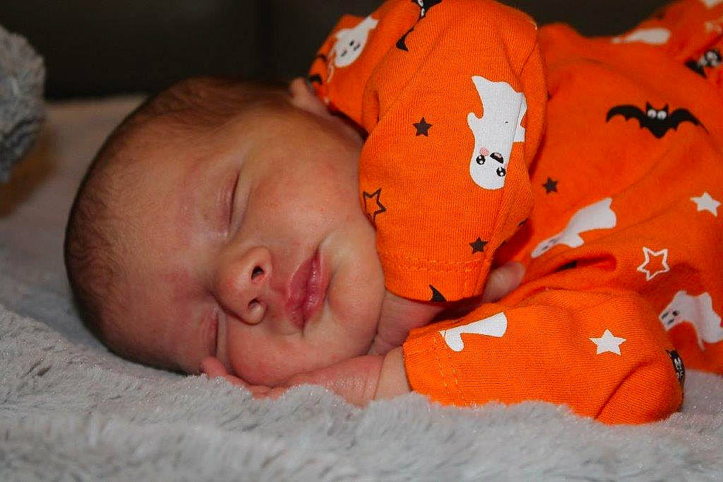 Cecilia is registered to the contest to win money with this photo: baby, baby_products, baby_sleeping, baby_toddler_clothing, bedtime, carmine, cheek, child, comfort, linens, nap, orange, person, room, skin, sleep, textile, toddler