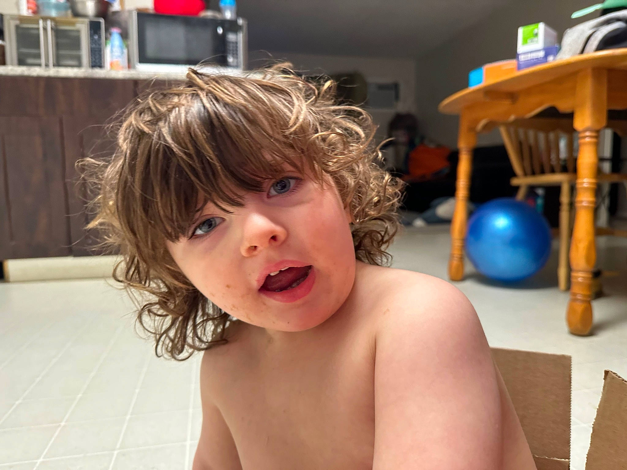 Xander is registered to the contest to win money with this photo: ball, barechested, bathing, blond, cheek, chest, child, eyelash, flooring, fun, hairstyle, happy, jaw, leisure, lip, neck, nose, person, smile, table
