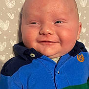 Spencer joined the competition — help win amazing prizes! baby, background, blue, button, child, closeup, clothing, cute, expression, face, green, happy, head, heart, infant, pattern, person, portrait, skin, smile