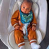 baby, infant, bib, orange_outfit, baby_rocker, baby_seat, white, child, indoor, carpet, footwear, socks, cute, portrait, young_child, comfort, expression, clothing, seated, adorable