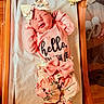 Saige is registered to the contest to win money with this photo: newborn, baby, infant, hospital, bassinet, pink_outfit, floral_clothing, bow_hat, sleeping, face, portrait, birth_announcement, crib, blanket, medical_setting, baby_clothes, tiny_feet, hands, indoor, newborn_photography