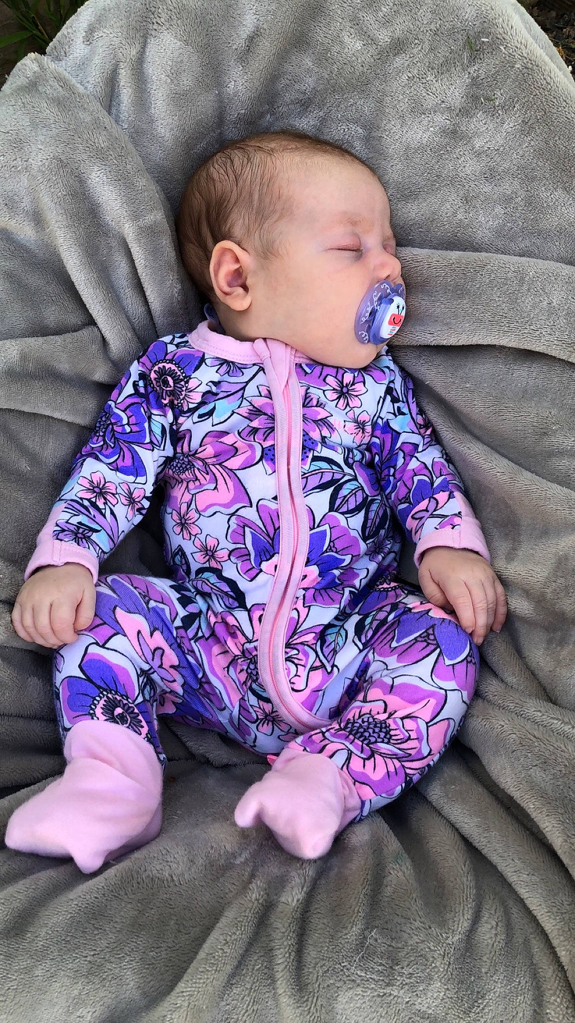 Harriet is registered to the contest to win money with this photo: baby, baby_toddler_clothing, child, pattern, person, pink, purple, sitting, sleep, toddler, violet