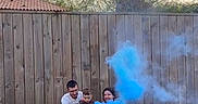 Augustin participe au concours pour gagner de l'argent avec cette photo : adult, backyard, blue_smoke, casual_clothing, celebration, child, cloudy_sky, family, fence, fun, grass, happy, kneeling, nature, outdoor, people, playing, smoke, toddler, tree