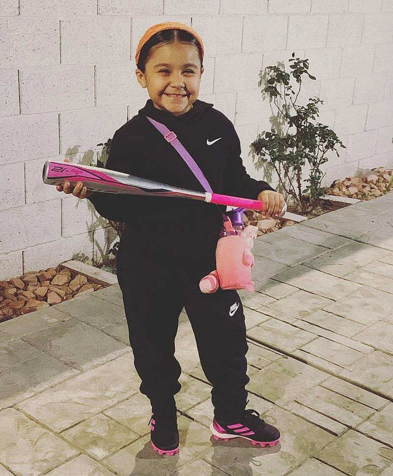 Victoria joined the competition — help win amazing prizes! child, costume, face, fashion_accessory, happy, joy, leisure, magenta, musician, outerwear, person, pink, plant, recreation, shoe, sitting, sleeve, smile, sneakers, street