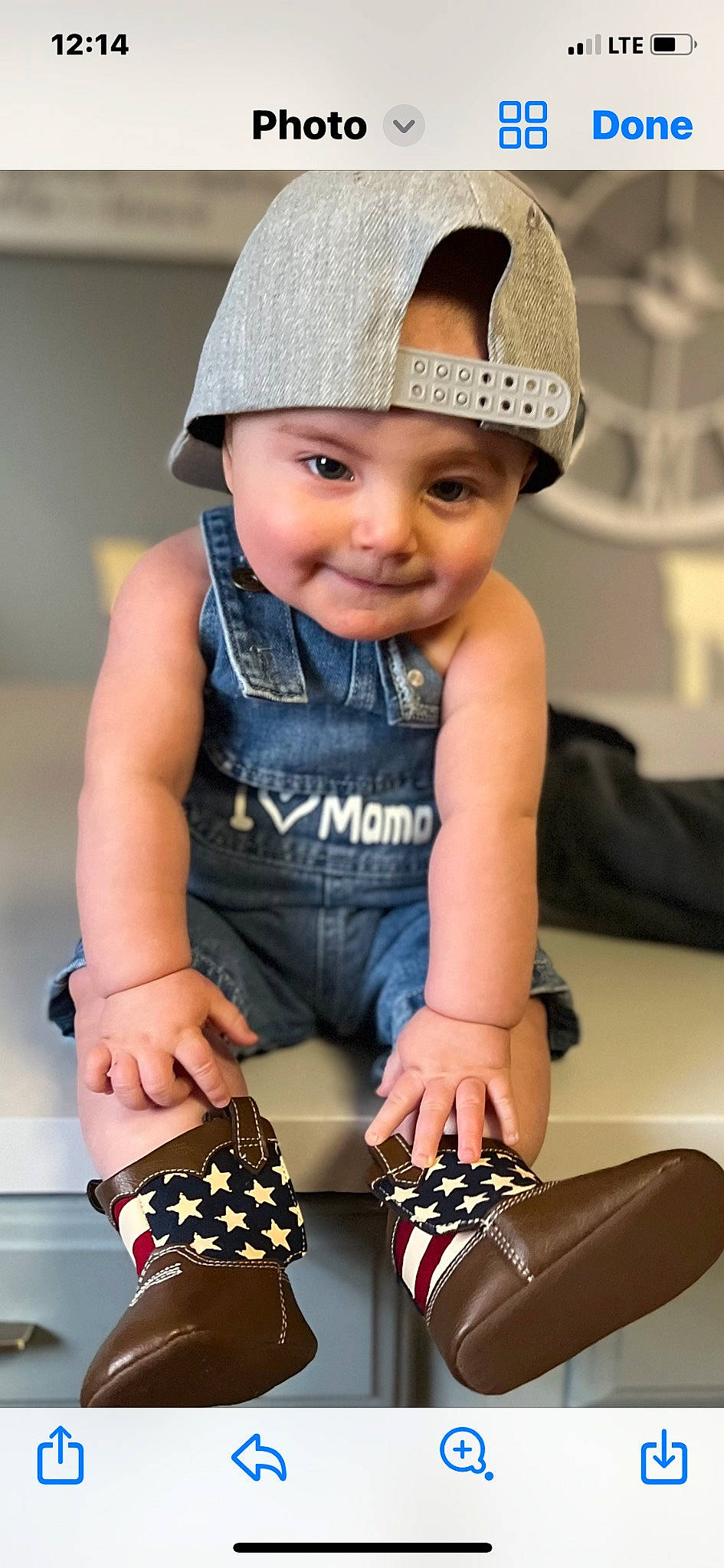Armani is registered to the contest to win money with this photo: baby_toddler_clothing, beauty, black, cap, cool, costume_hat, electric_blue, fashion, happy, hat, headwear, joy, knee, person, photograph, sleeve, sleeveless_shirt, smile, sun_hat, thigh