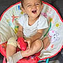Cloé participe au concours pour gagner de l'argent avec cette photo : carpet, cartoon_prints, chair, child, colorful, cute, expression, furniture, indoor, living_room, person, playful, red, sitting, smiling, socks, toddler, toy, white_shirt, young_child