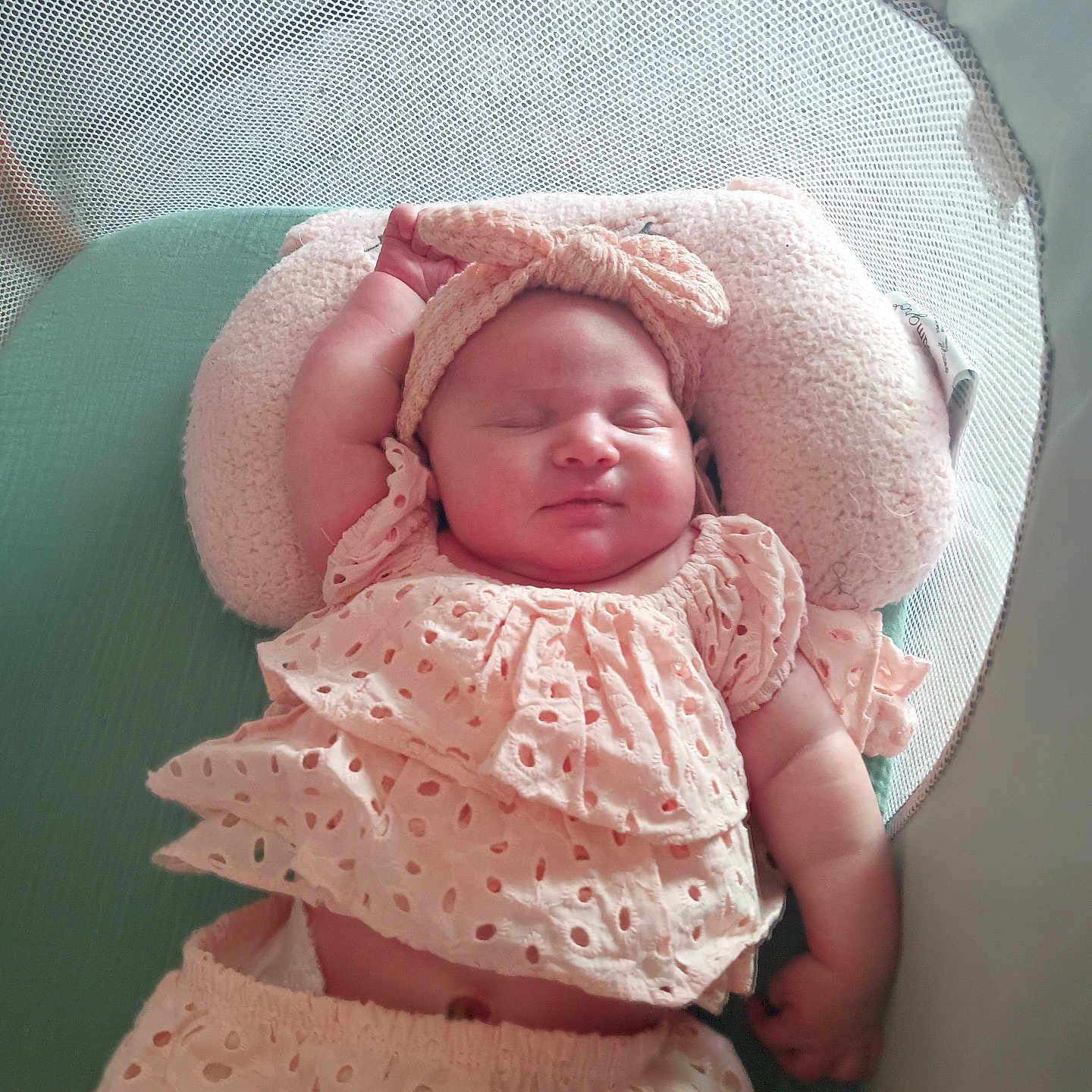 Kinsley Jones joined the competition — help win amazing prizes! baby, sleeping, headband, pink_clothing, playpen, pillow, infant, cute, peaceful, rest, child, soft_toys, cozy, nap, indoor, portrait, adorable, relaxing, newborn, baby_clothes