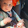 baby, child, car_seat, orange_bow, infant, seatbelt, clothing, person, portrait, indoor, sunlight, cute, looking, seat, car, young_child, headband, expression, hands, apparel