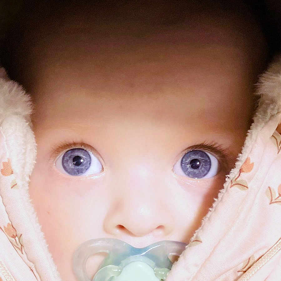 Ellie-Joy joined the competition — help win amazing prizes! adorable, baby, blanket, blue_eyes, child, close_up, cozy, cute, expression, face, infant, looking, pacifier, portrait, skin, snug, soft_texture, warm, wrapped, young