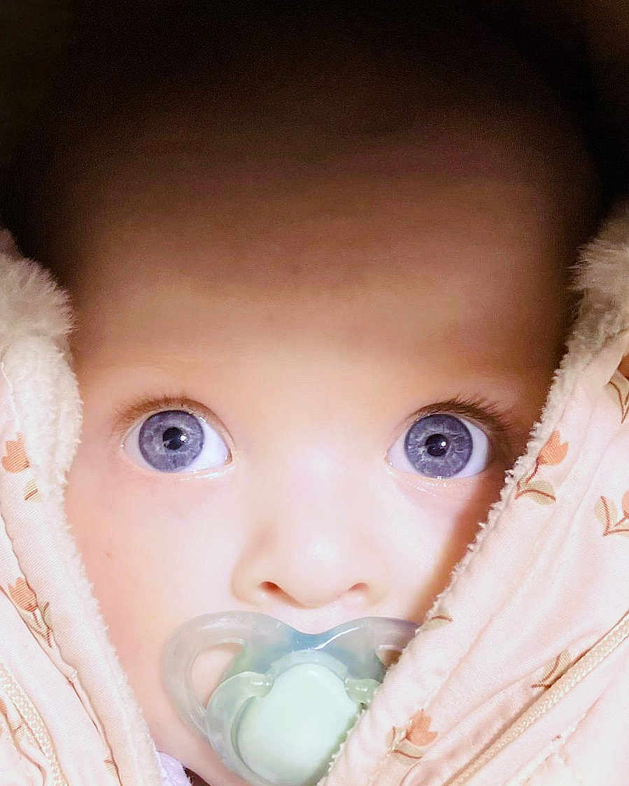 Ellie-Joy joined the competition — help win amazing prizes! baby, close_up, blue_eyes, pacifier, blanket, face, infant, child, snug, soft_texture, cute, wrapped, portrait, looking, young, cozy, warm, skin, expression, adorable