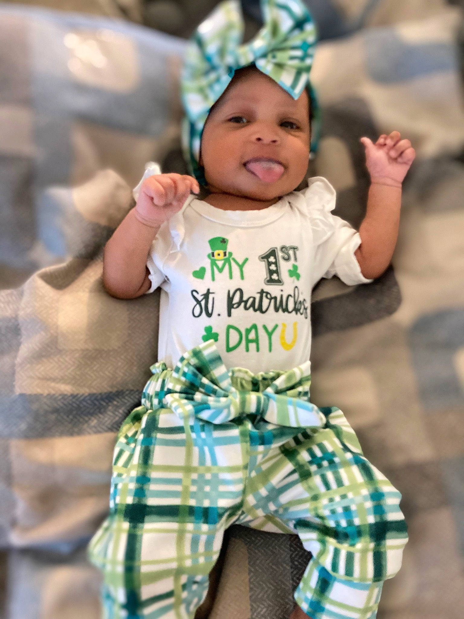 Alexis is registered to the contest to win money with this photo: baby, baby_toddler_clothing, child, facial_expression, fun, gesture, happy, headwear, human, leisure, pattern, person, photography, play, portrait_photography, sitting, sleeve, smile, t_shirt, toddler