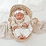 Suzanne participe au concours pour gagner de l'argent avec cette photo : newborn, baby, sleeping, basket, knitwear, headband, blanket, cozy, infant, cute, soft, peaceful, portrait, child, resting, woven_basket, white, neutral_colors, indoors, photography