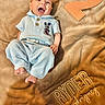 baby, infant, smiling, blue_clothing, mickey_mouse, blanket, embroidery, number_two, happy, cute, portrait, child, soft_texture, lying_down, celebration, milestone, infant_clothing, head, feet, person
