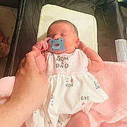 Jade is registered to the contest to win money with this photo: baby, bed, blanket, child, clothing, cozy, cute, family, hand, infant, love, newborn, pacifier, parent, pink, resting, sleeping, soft, toddler, white