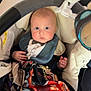 Kellyo a rejoint le concours — aidez-le/la à gagner de superbes lots ! baby, infant, car_seat, blanket, bib, toy, indoor, face, blue_eyes, clothing, cute, child, person, seat_belt, fabric, soft_toys, portrait, expression, hands, toddler