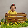 Daisy joined the competition — help win amazing prizes! baby, bright, child, crate, cute, decor, greenery, happy, indoor, infant, leaves, lemons, nature_elements, playful, portrait, posing, smiling, toddler, wooden_crate, yellow_clothing