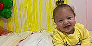 Daisy is registered to the contest to win money with this photo: architecture, baby, balloon, bed, bedroom, blanket, building, face, furniture, happy, head, indoors, laughing, outdoors, person, photography, portrait, quilt, room, shelter