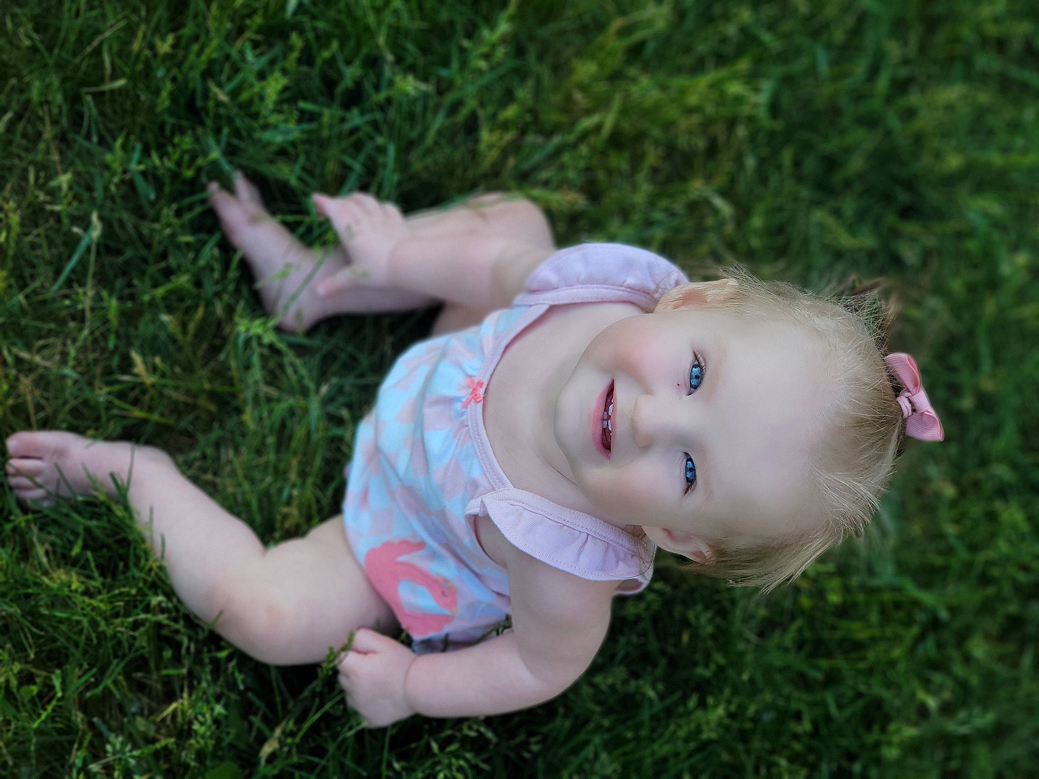 Ellianna is registered to the contest to win money with this photo: baby, baby_toddler_clothing, child, fun, grass, grassland, happy, hat, joy, meadow, people_in_nature, person, plant, portrait_photography, prairie, recreation, sitting, skin, smile, thumb