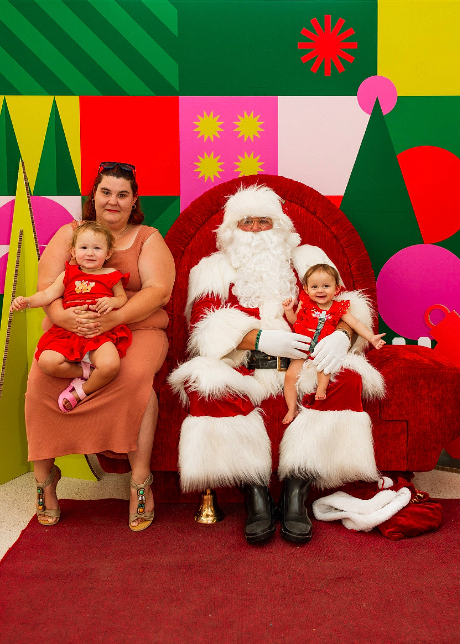 Portia joined the competition — help win amazing prizes! baby, beard, christmas_decoration, christmas_ornament, event, fictional_character, fun, green, happy, hat, holiday, joy, lap, magenta, ornament, person, pink, red, santa_claus, smile