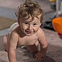 Xayden is registered to the contest to win money with this photo: toddler, child, baby, crawling, smiling, curly_hair, indoor, carpet, face, happy, skin, person, cute, young_child, playful, expression, closeup, home, floor, blurry_background