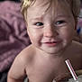 Xayden is registered to the contest to win money with this photo: toddler, child, smile, blonde_hair, face, cup, straw, drink, indoor, blanket, closeup, portrait, skin, happy, young_child, person, baby, cute, casual, relaxed