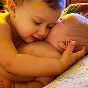 Laylani is registered to the contest to win money with this photo: baby, infant, hug, cuddle, close_up, tenderness, unicorn_pattern, pillow, sleepy, cute, skin, child, love, affection, newborn, family, indoors, soft_light, portrait, warmth