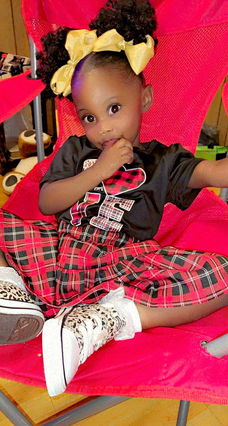 Dearra is registered to the contest to win money with this photo: baby_toddler_clothing, beauty, carmine, child, event, holiday, lap, linens, pattern, person, pink, plaid, red, sitting, sock, tartan, textile, thigh, toddler, toy