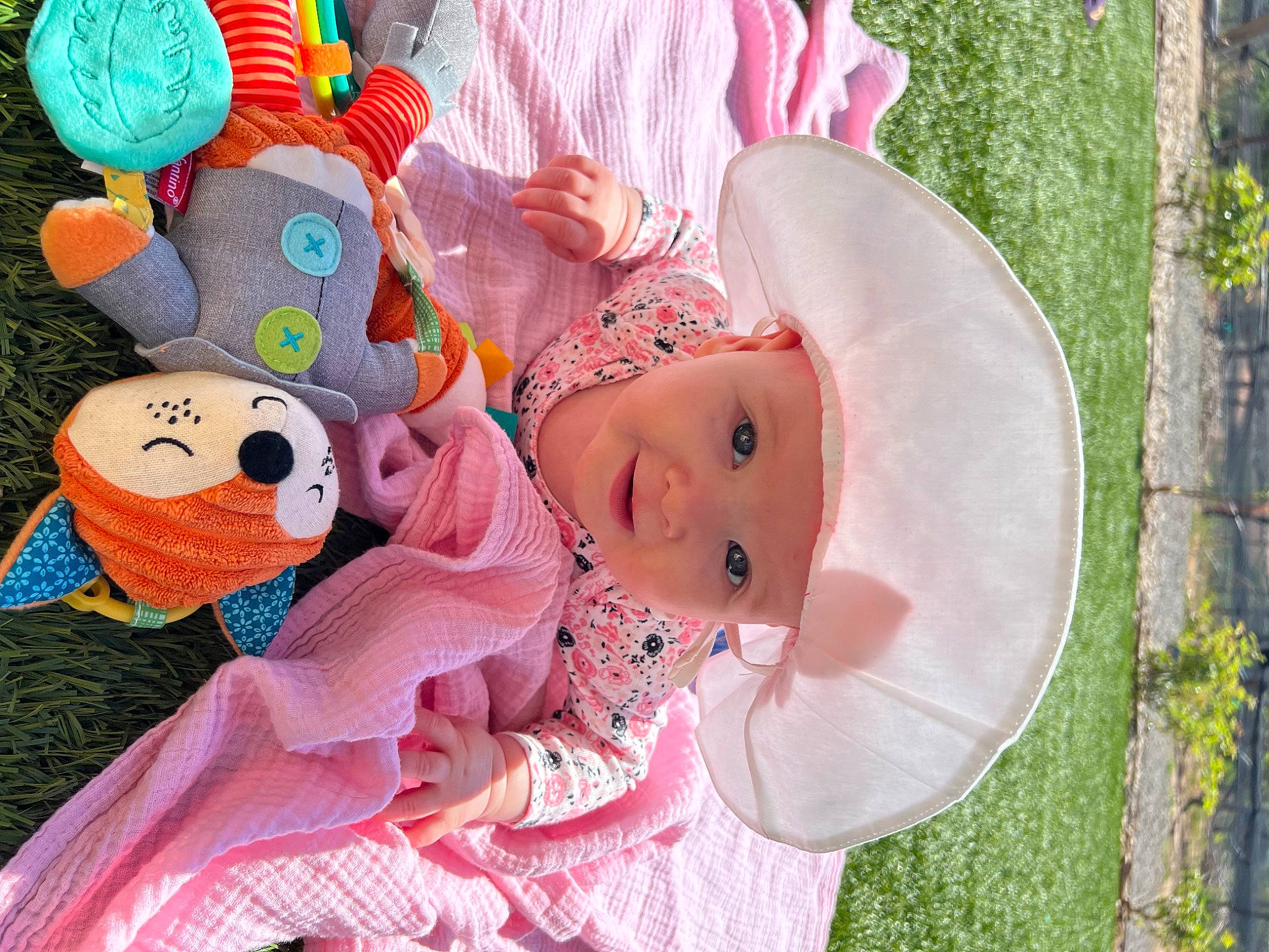 Remington joined the competition — help win amazing prizes! art, baby, baby_products, baby_toddler_clothing, child, costume_hat, event, fashion_accessory, fun, grass, happy, hat, headgear, headwear, party_supply, pattern, person, pink, plant, plush