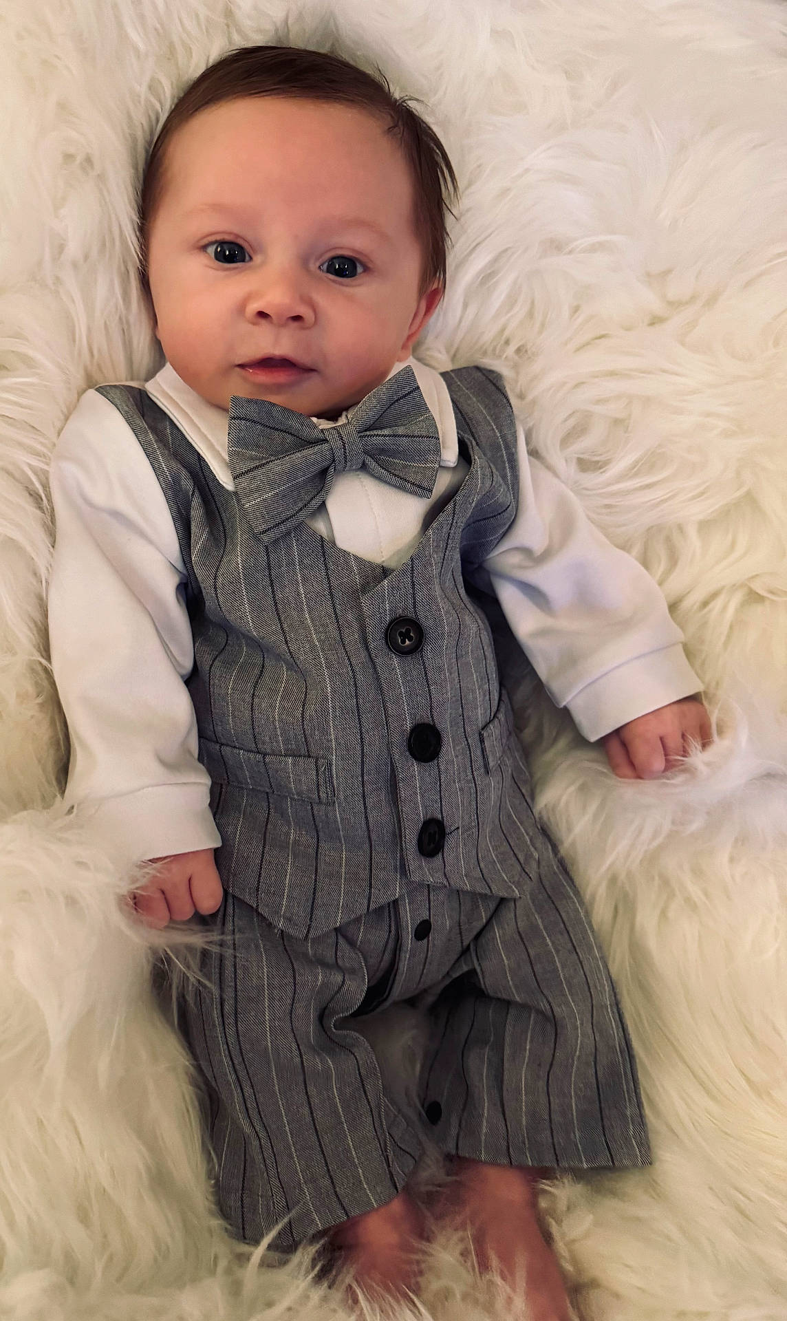 Jacob joined the competition — help win amazing prizes! baby, bow_tie, child, clothing, cute, eyes, face, fashion, feet, fuzzy_blanket, hands, indoors, infant, pants, portrait, soft_texture, suit, vest, white_shirt, young
