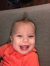 Wade is registered to the contest to win money with this photo: baby, baby_making_funny_faces, cheek, child, chin, ear, eye, eyebrow, face, facial_expression, forehead, hair, head, iris, joy, lip, mouth, nose, person, skin