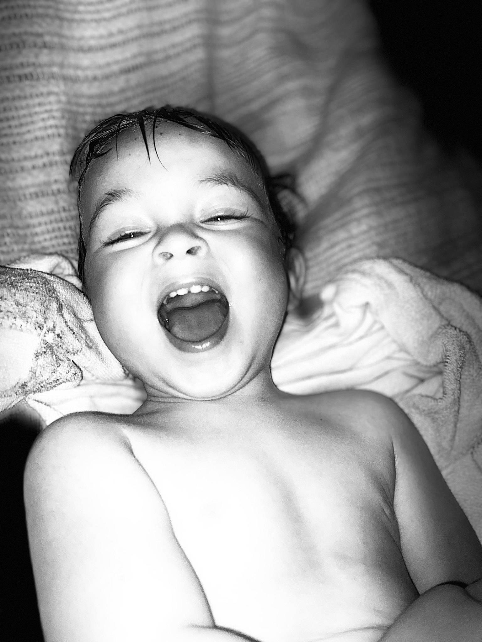 John Michael is registered to the contest to win money with this photo: baby, black_and_white, cheek, child, face, facial_expression, fun, happy, human, laugh, monochrome, mouth, nose, person, photograph, photography, shout, skin, smile, toddler