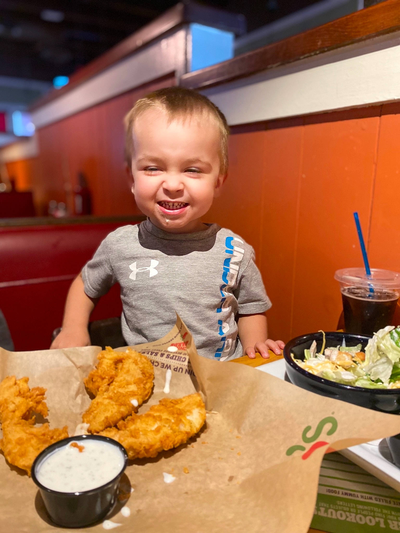 John Michael is registered to the contest to win money with this photo: chair, comfort_food, cooking, cuisine, dish, fast_food, finger_food, food, food_craving, fried_food, ingredient, joy, junk_food, orange, person, plate, recipe, sharing, smile, table