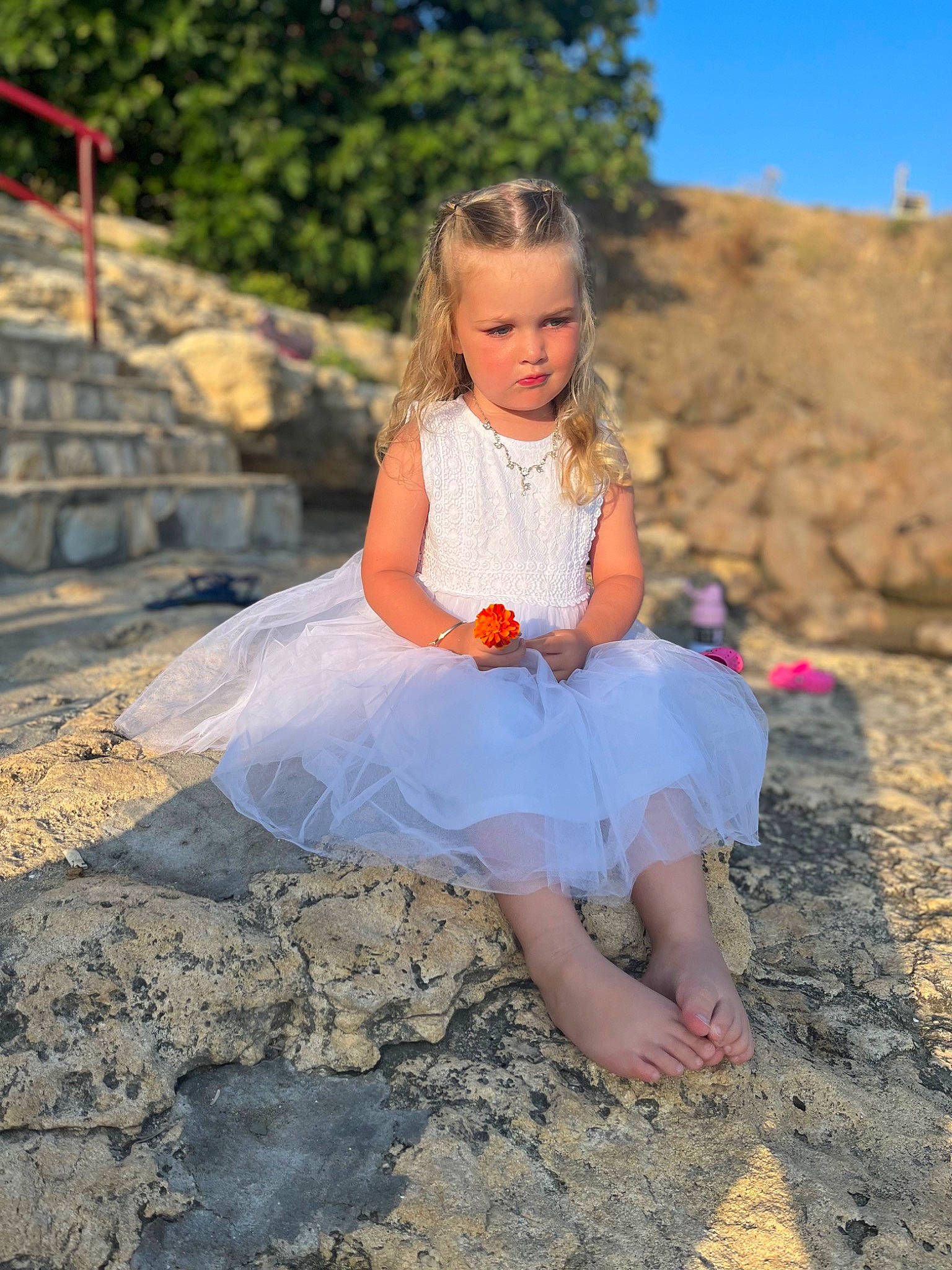 Sofia is registered to the contest to win money with this photo: beauty, blond, child, day_dress, dress, flash_photography, fun, grass, happy, landscape, leisure, people_in_nature, person, plant, sitting, sky, smile, sunlight, toddler, tree