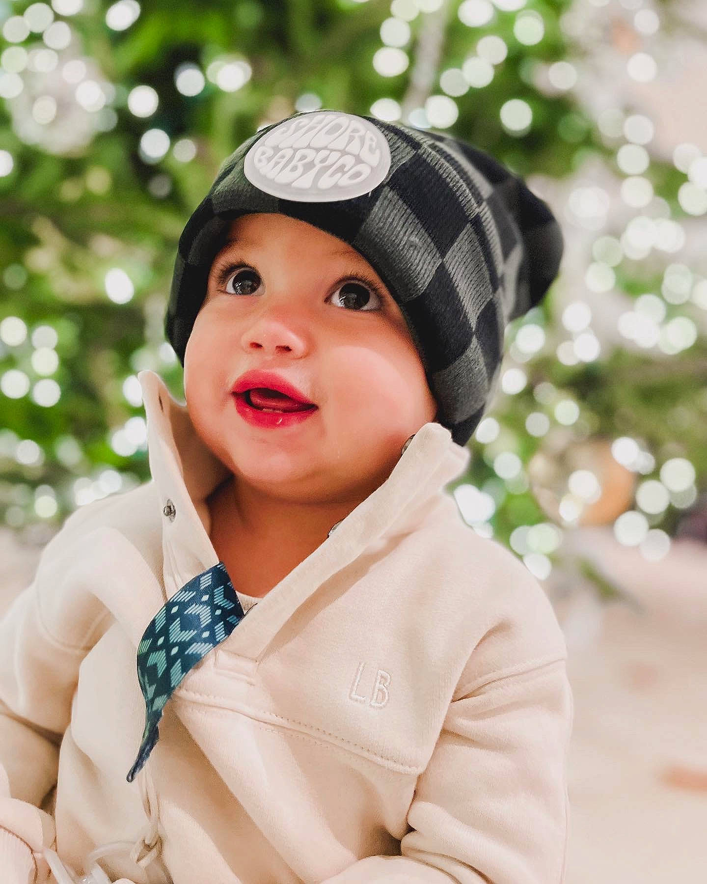 Radley is registered to the contest to win money with this photo: baby, baby_toddler_clothing, beanie, cap, child, clothing, collar, fashion_accessory, flash_photography, happy, hat, headwear, lip, outerwear, pattern, peach, person, plaid, portrait_photography, sleeve
