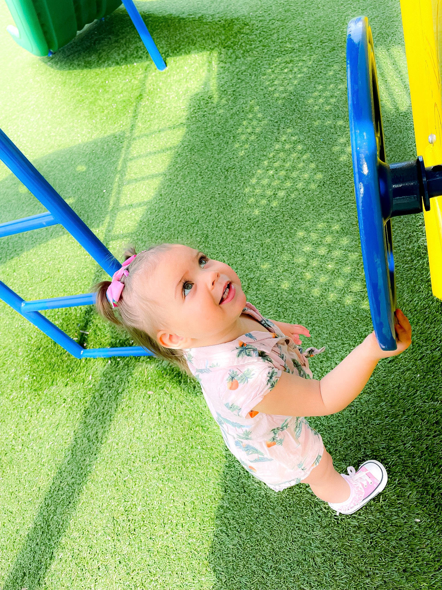 Oakleigh is registered to the contest to win money with this photo: baby, baby_toddler_clothing, child, city, electric_blue, flooring, fun, grass, grassland, happy, lawn, leisure, outdoor_play_equipment, people_in_nature, person, play, playground, recreation, smile, swing