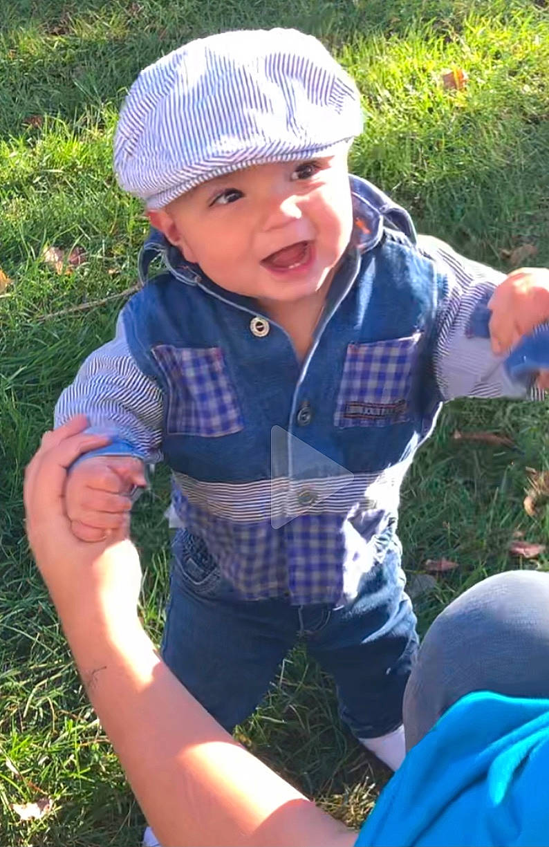 Mika joined the competition — help win amazing prizes! baby, baby_toddler_clothing, blue, botany, cap, clothing, cool, eye, facial_expression, finger, grass, hand, happy, headgear, headwear, leaf, people_in_nature, person, plant, summer